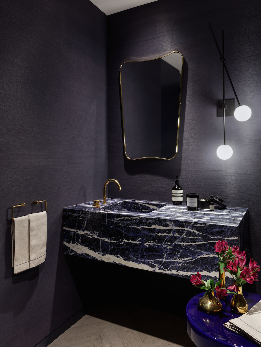 Powder room with Sodalite Blue marble and brass fixtures