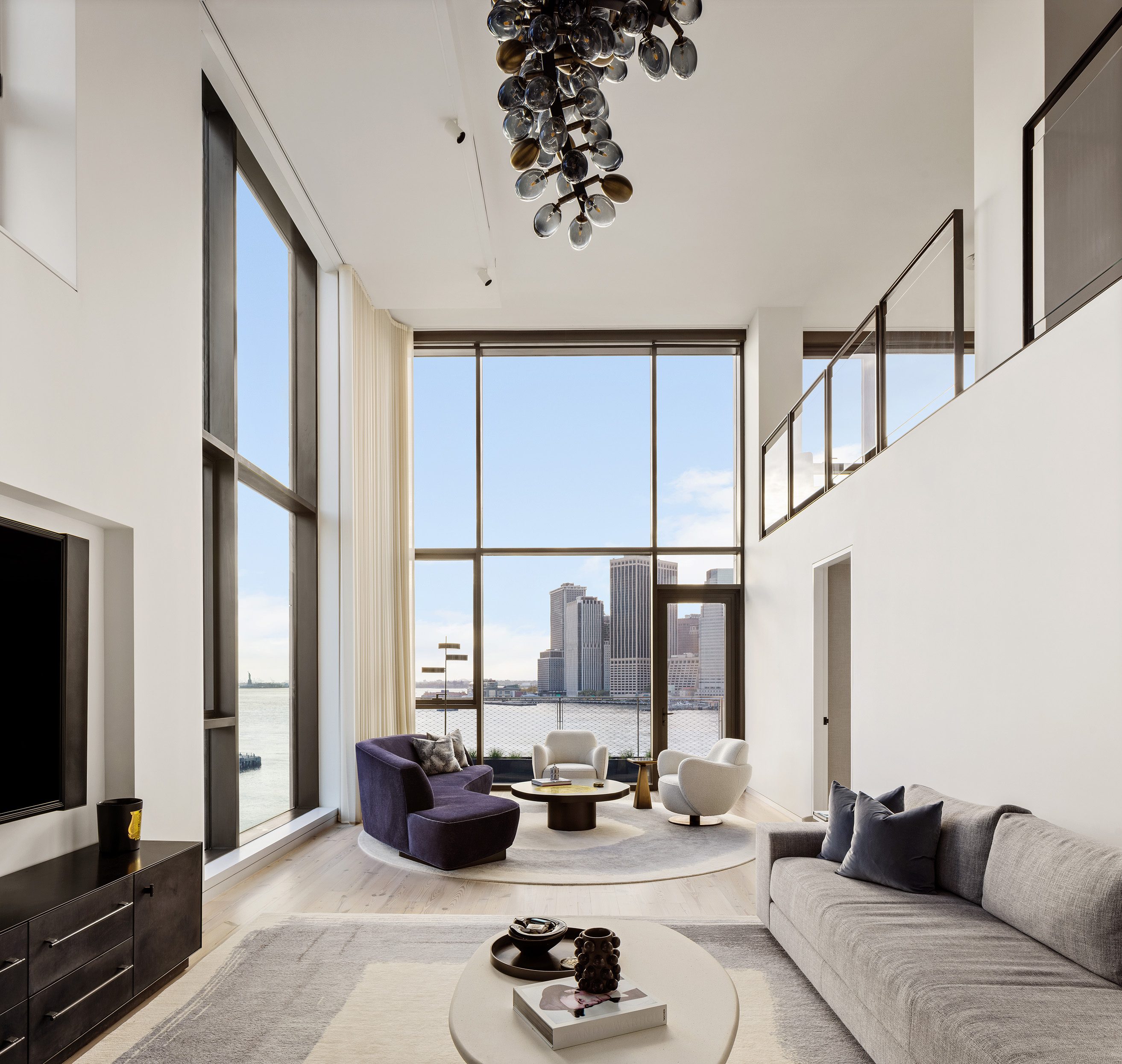Double-height living room with Manhattan views