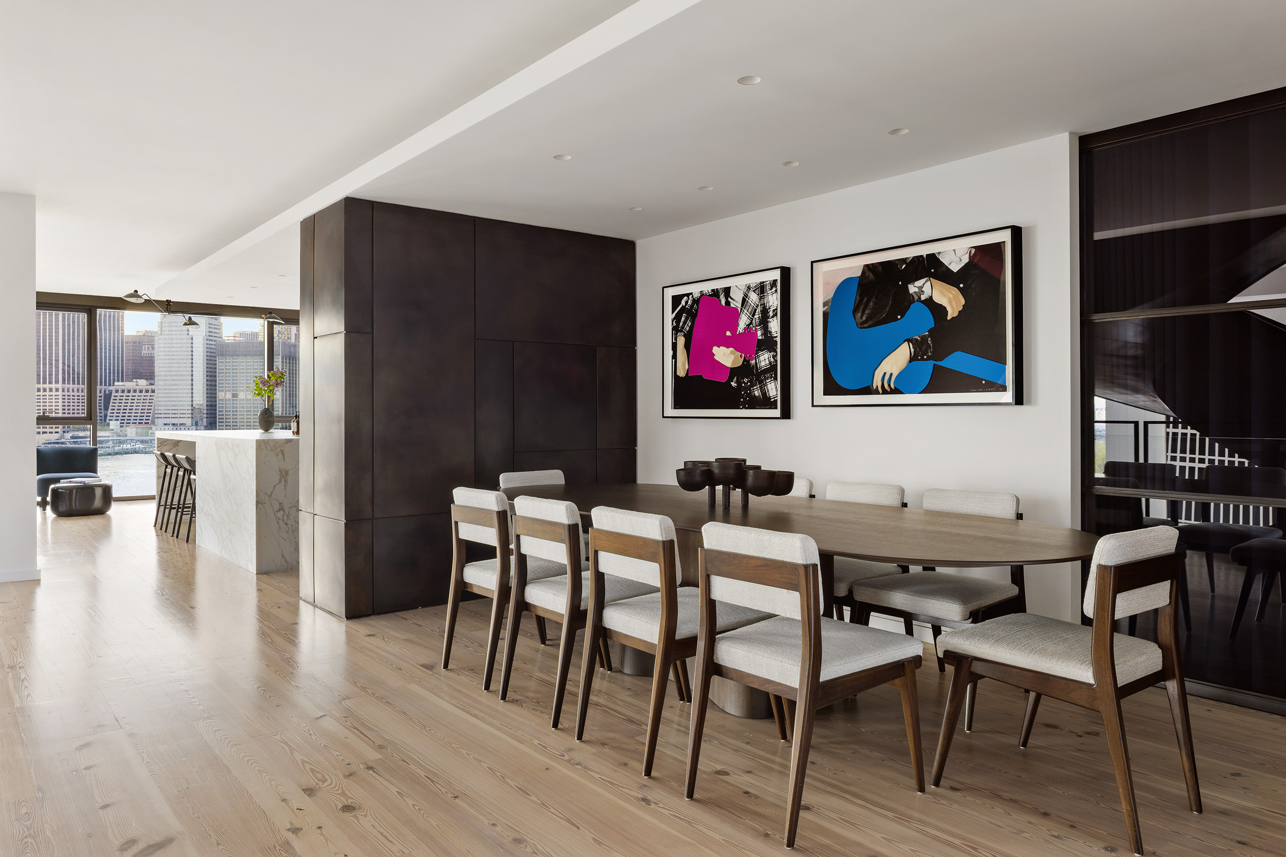 Dining room with dark panel walls and Manhattan views