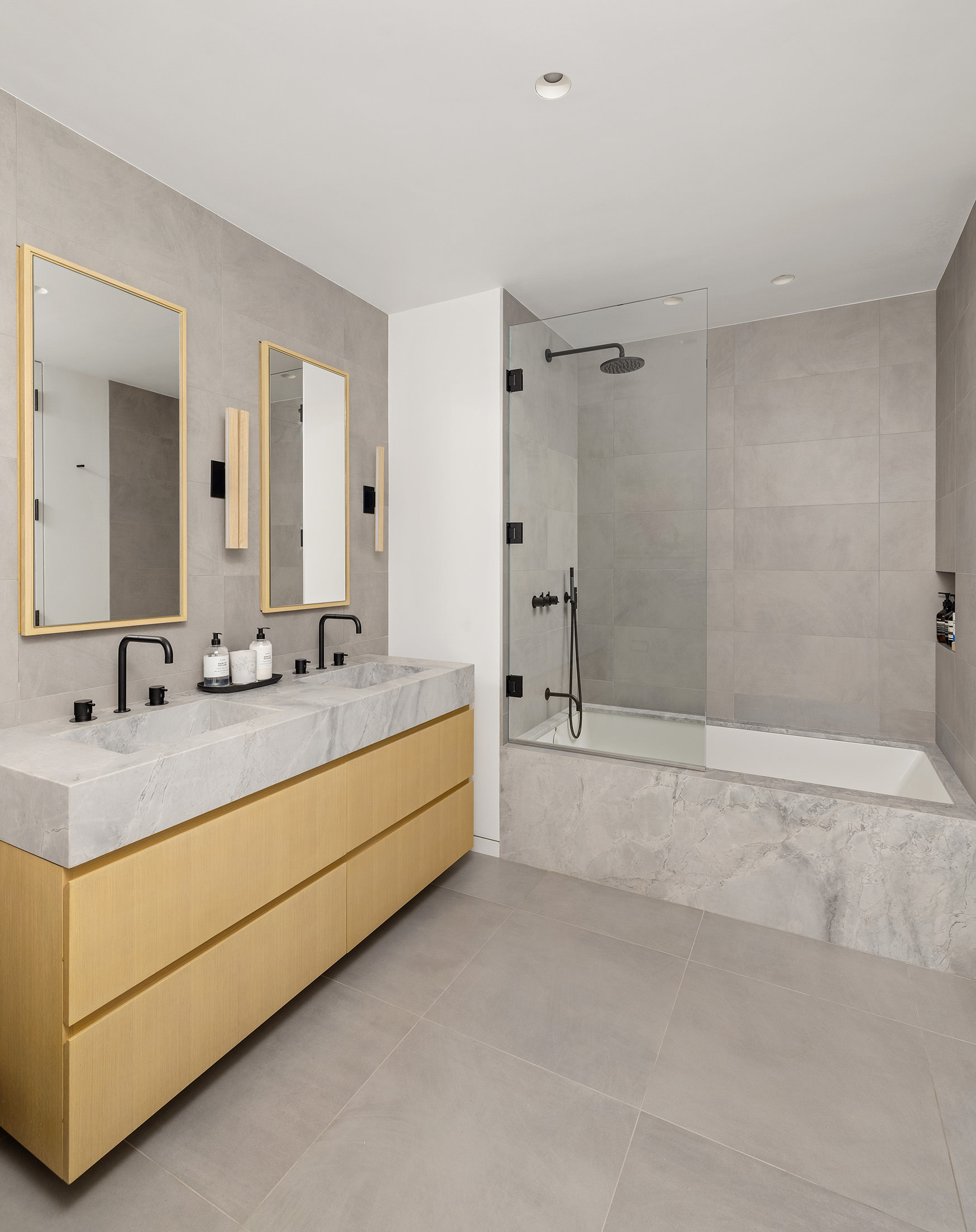 Guest bathroom with double marble vanity and soaking tub